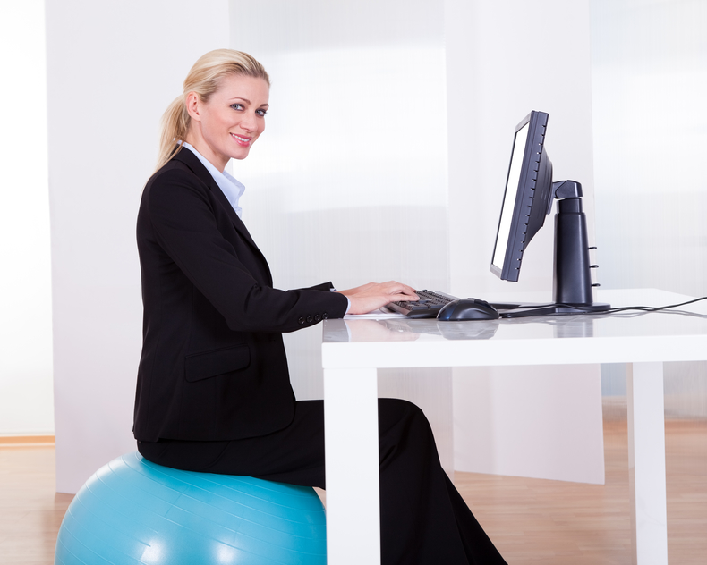 ergonomical assessment lady on excercise ball at work