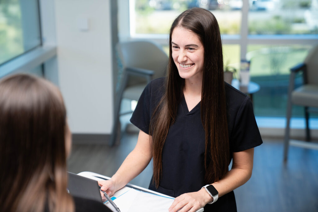 Case manager discussing the next step in the care plan with a patient in a rehabilitation hospital.