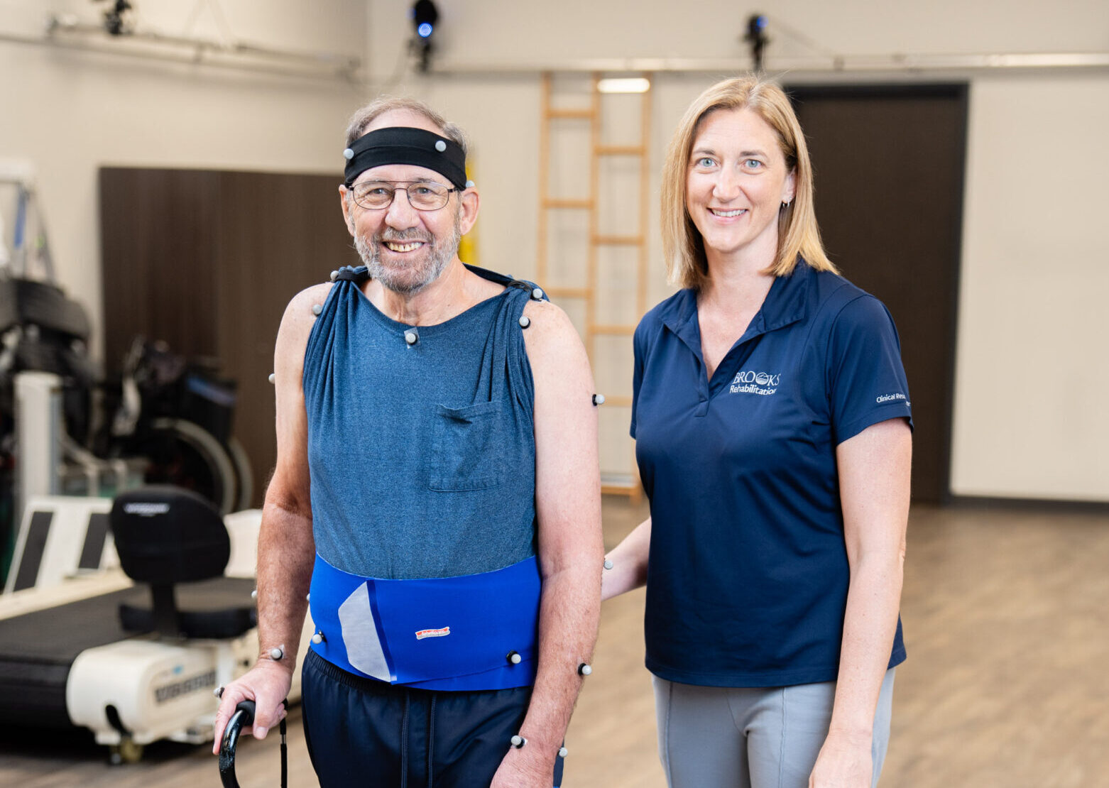A patient walks with special sensors on his body so that the technology in the MAC can track his movements.