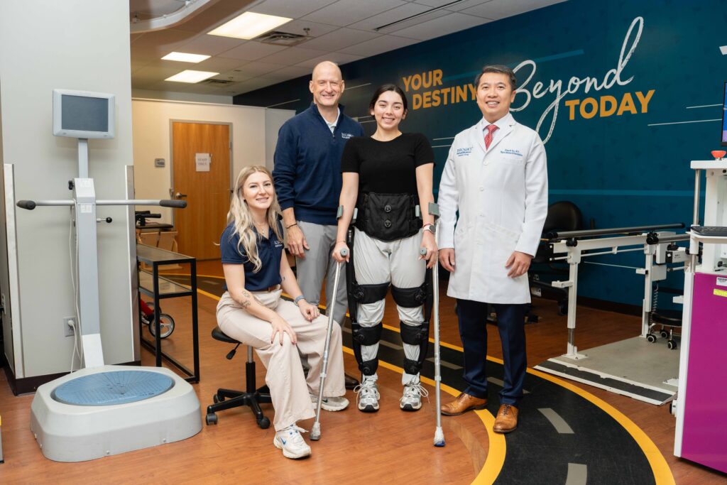 therapist, patient and team posing in the NRC