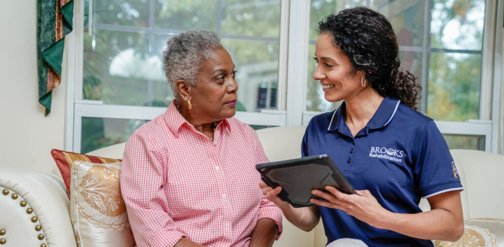 A Brooks Rehabilitation employee and patient participate in home health