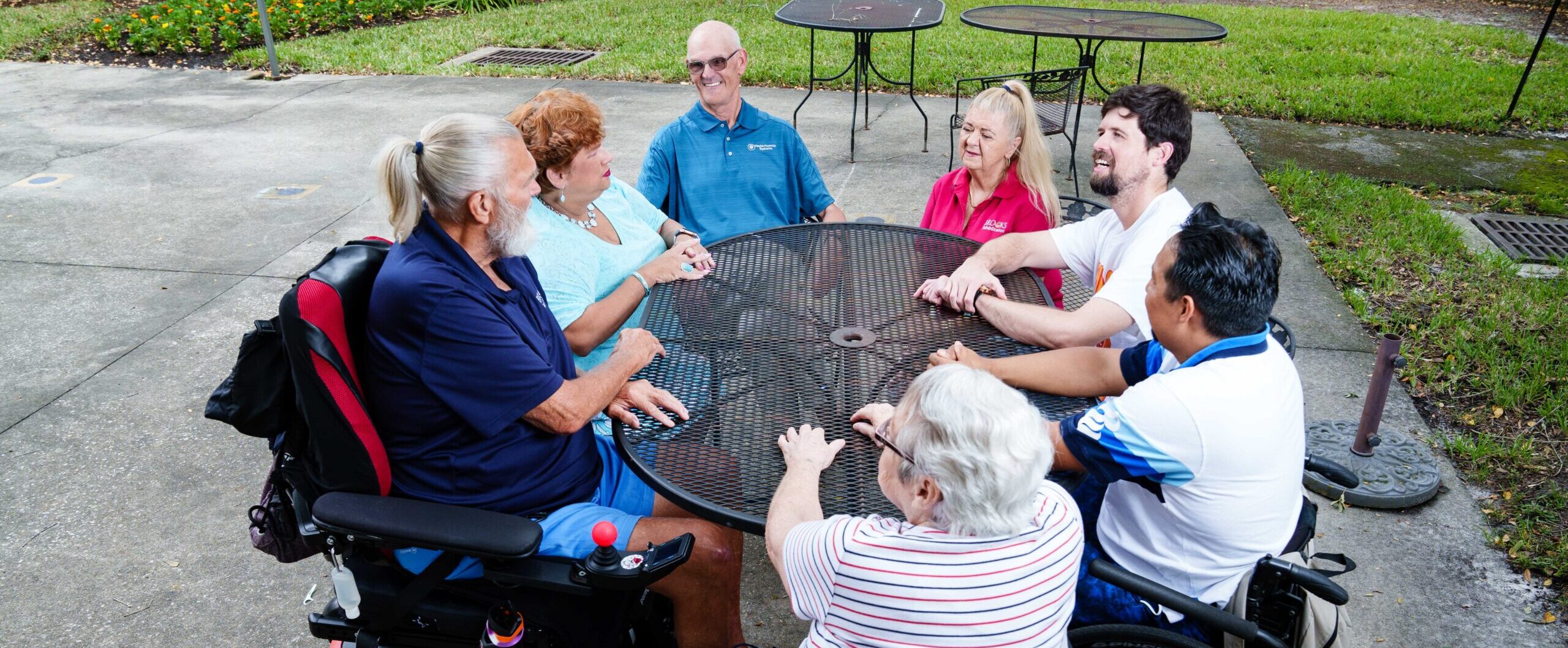 People surrounding table outside