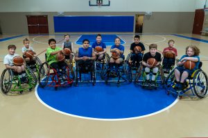 Group of kids from the new Jr wheelchair basketball team at Brooks Rehab