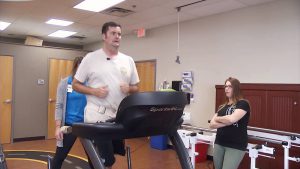 Officer runs on treadmill at Brooks Rehabilitation