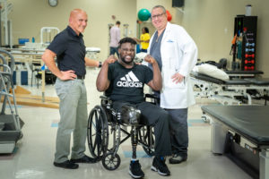 Jalen Bryant flexes with doctors at Brooks Rehabilitation