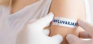 A campaign ad to increase flu vaccinations with the hashtag FLUVAXJAX