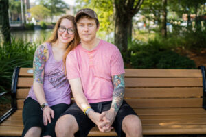 Glen Allen and his wife Amanda sitting on a bench after his recovery