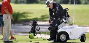 Man golfing with assistive equipment