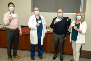 Four staffers after getting their vaccines