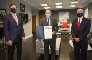 Doug Baer posing with proclamation