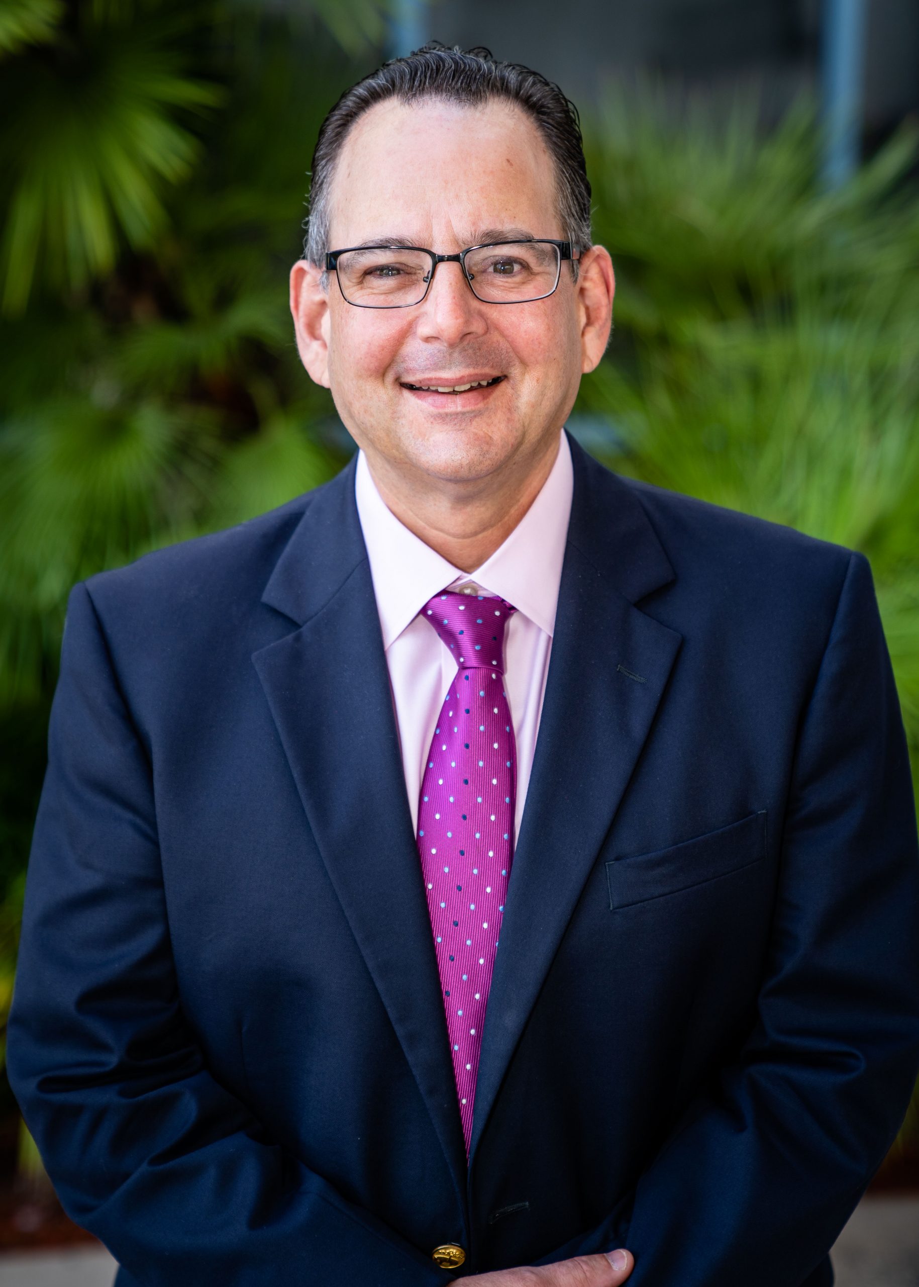 Russ Addeo smiling at the camera outside