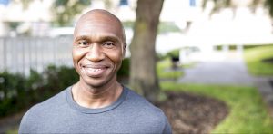 Man standing outside smiling at the camera