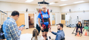 Brooks patient in a ceiling mounted track being examined