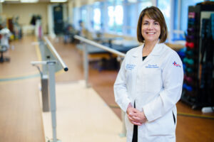 Dr. Maher in front of balancing beams