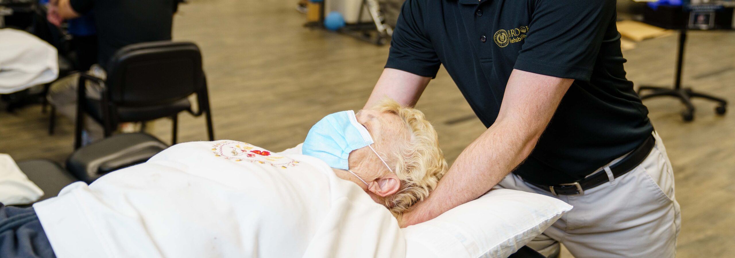 TMD Therapy patient receiving a neck examination