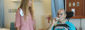 Patient performing a breath test for a speech therapist