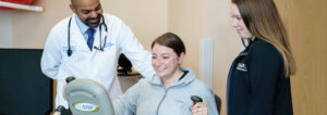 Dr. Shah observing a patient on an exercise machine