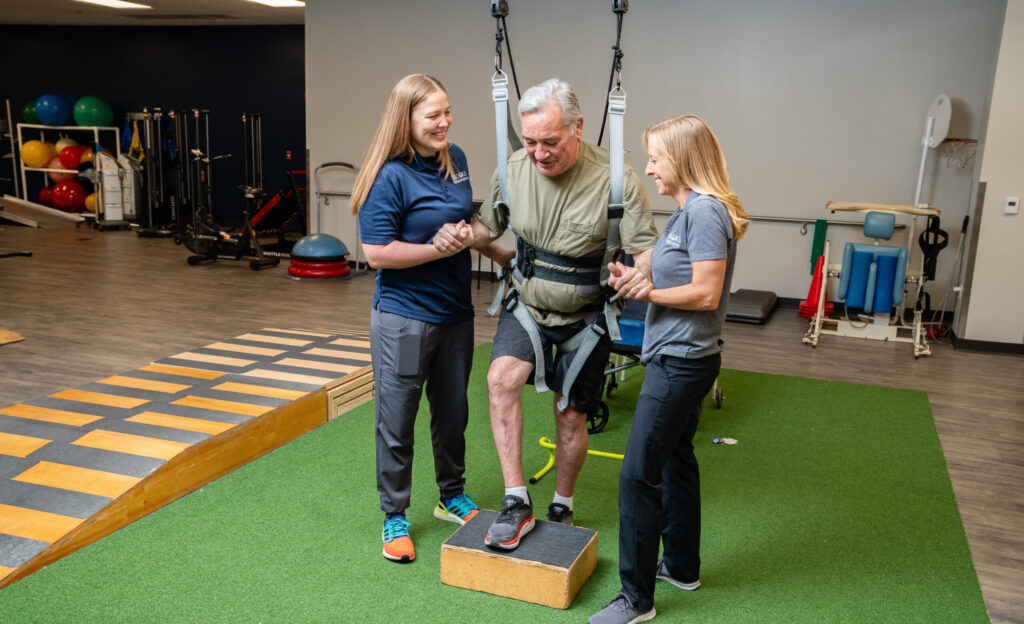 Spinal chord injury patient doing physical therapy