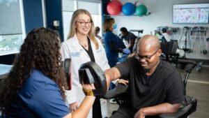 Dr Tribuzio working with SCI patient