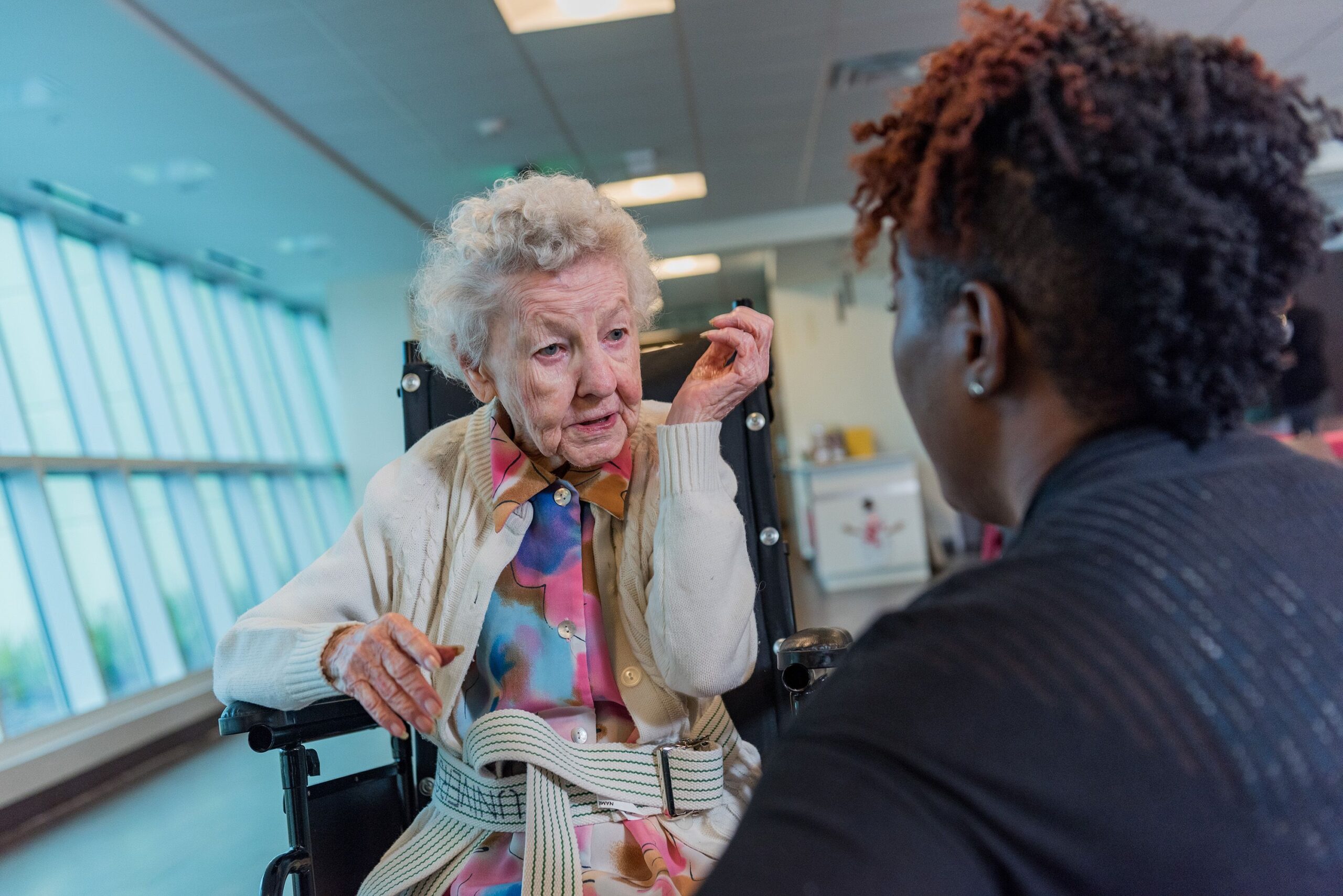 Patient walking with Brooks employee