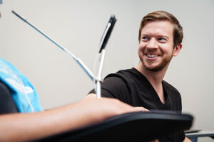 Dr. Higdon smiling at a patient