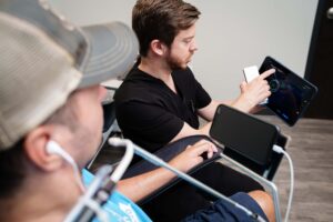 Dr. Brian Higdon showing a patient results on a tablet device