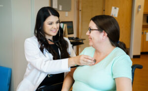 Dr. List checking patient heart