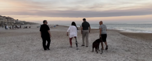 Amputee patient and family walking on a beach