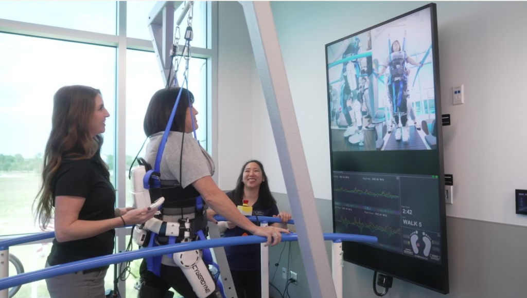 Brooks research team working on walking study with patient.