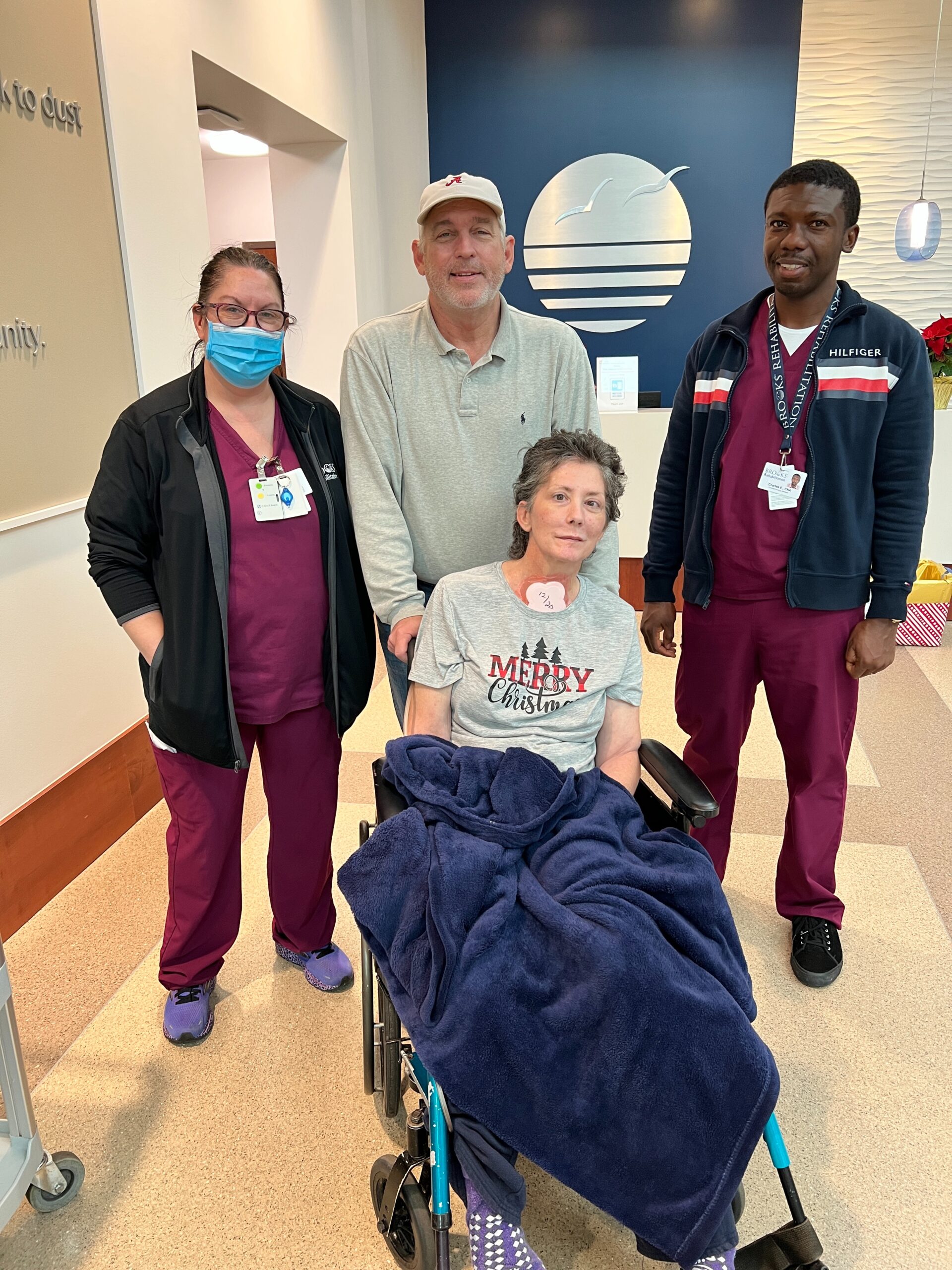 Alese Hairston pictured with her care team and husband Fred. 