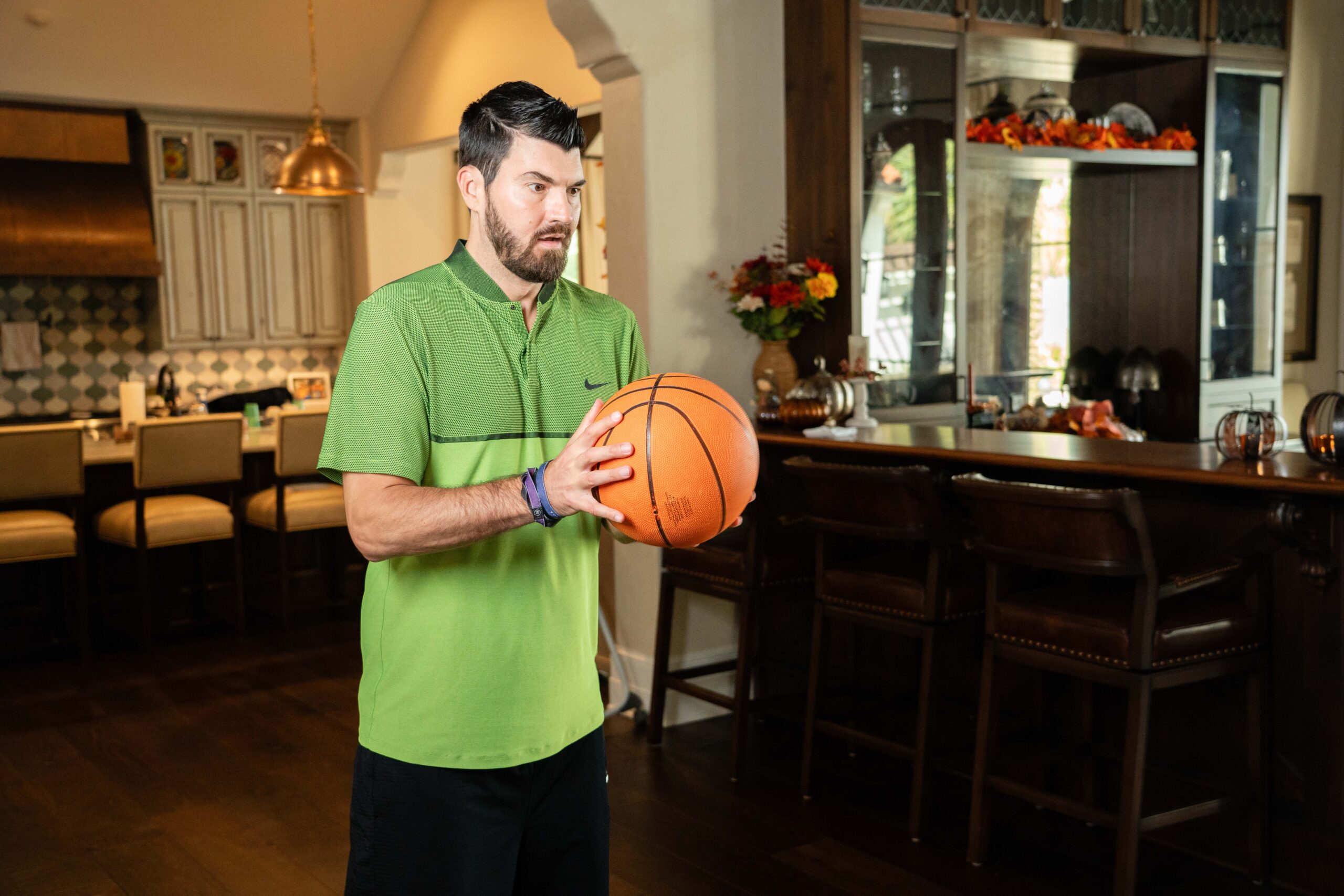 practicing catching and throwing a basketball is part of Eric Sorensen's physical therapy workouts. 