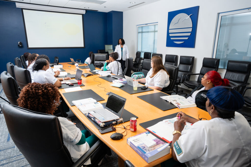 nursing students sitting in a board room at Brooks Rehabilitation training to become LPNs.