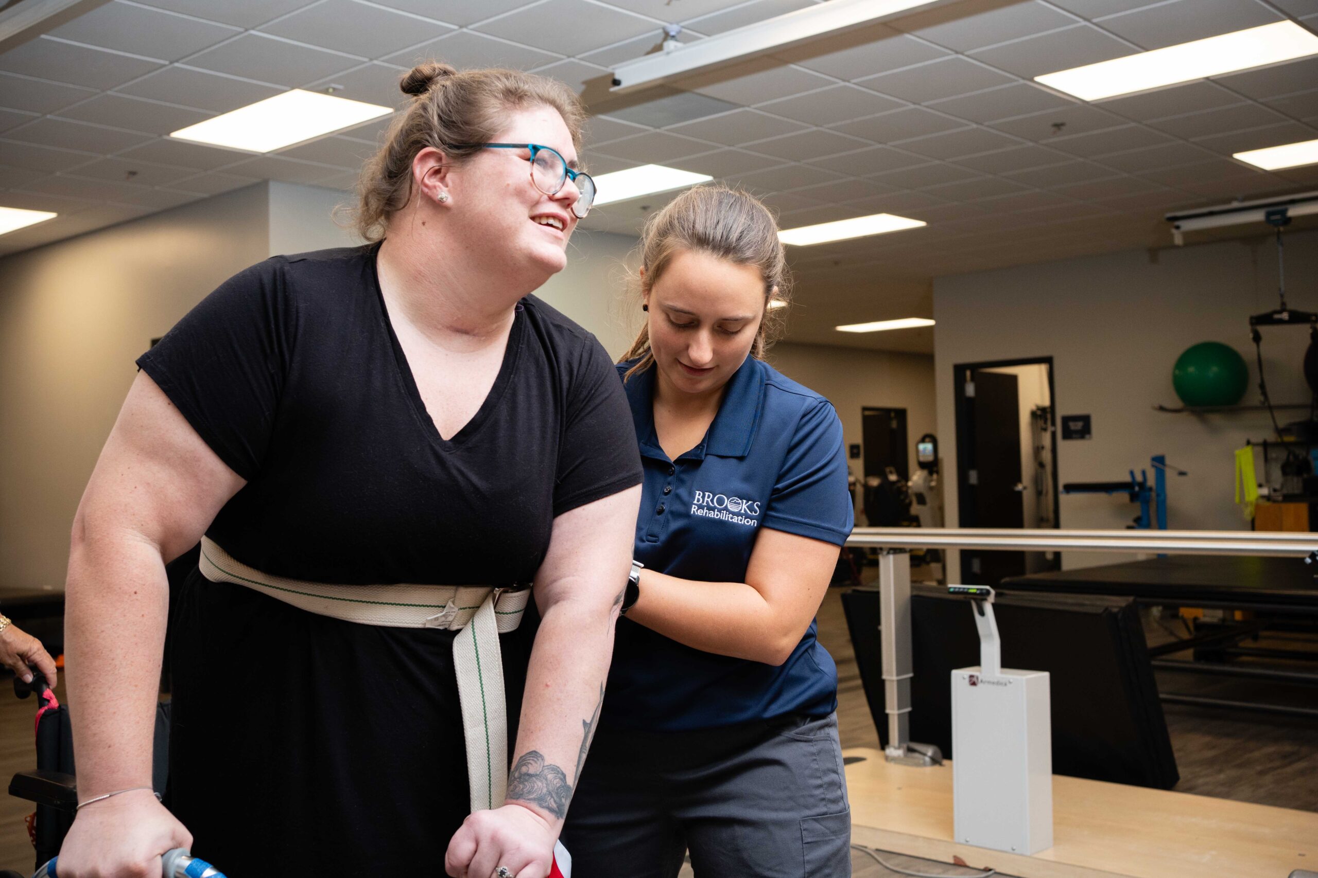 Occupational therapist works with a stroke patient at Brooks.