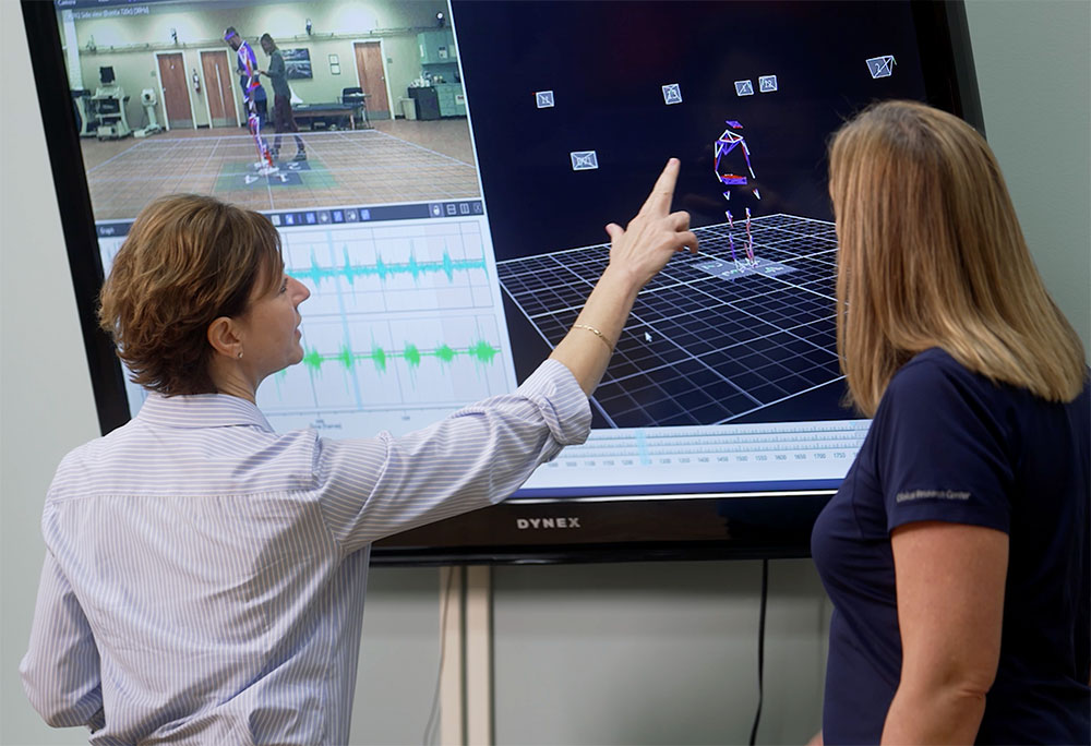 Brooks Rehabilitation doctors reviewing a patient's movements with technology