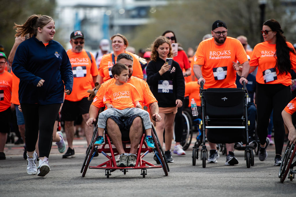 participants in the Brooks Challenge Mile race to the finish line.
