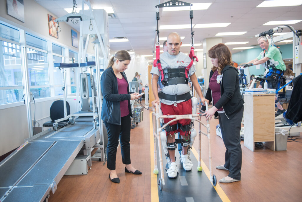 patient using exoskeleton and cyberdyne in the neuro recovery center.