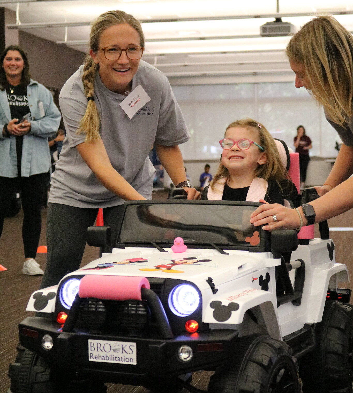 a child tries out mobility car during the gobaby go event at Brooks Rehabilitation.