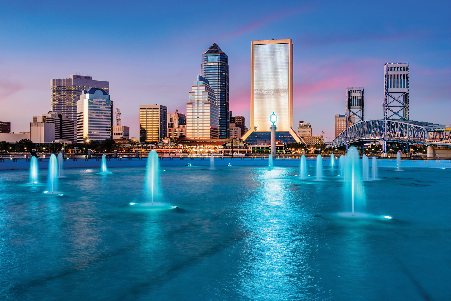 The downtown Jacksonville skyline at dusk.