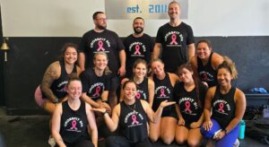 Candy posing with crossfit team