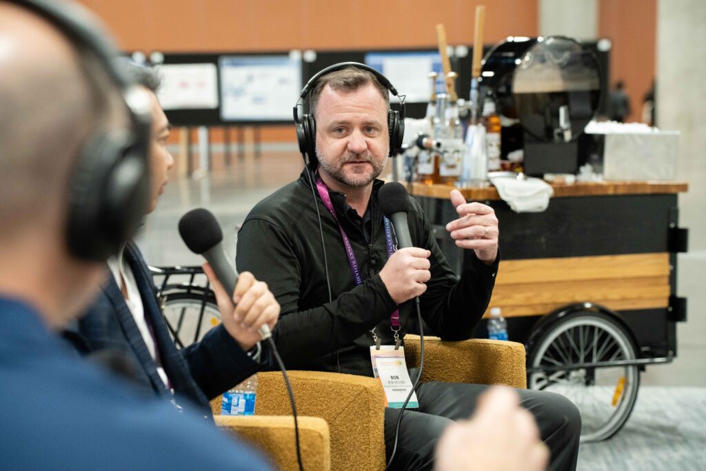 Man with microphone and headset recording podcast