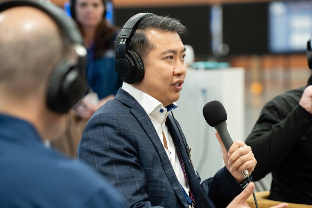 Man with microphone and headset recording podcast