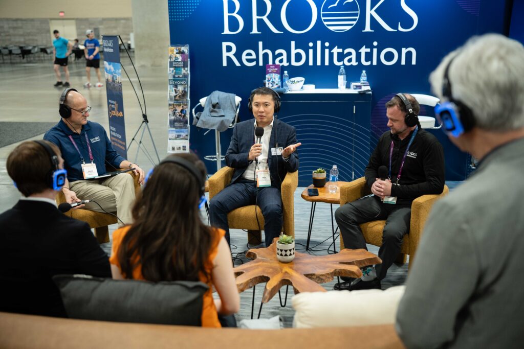 Man with microphone and headset recording podcast