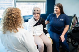 Dr. Shapiro observes a stroke patient in the hospital gym with a physical therapist