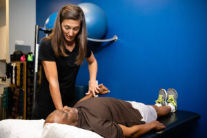 Mallory Behenna working with patient