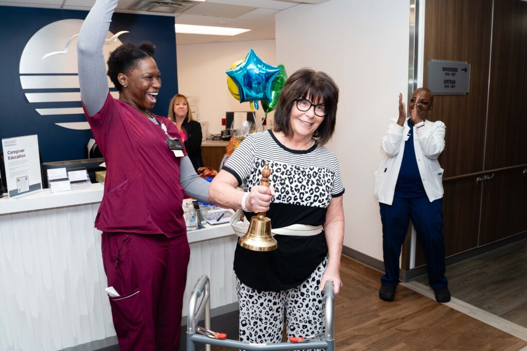 patient ringing bell with therapist
