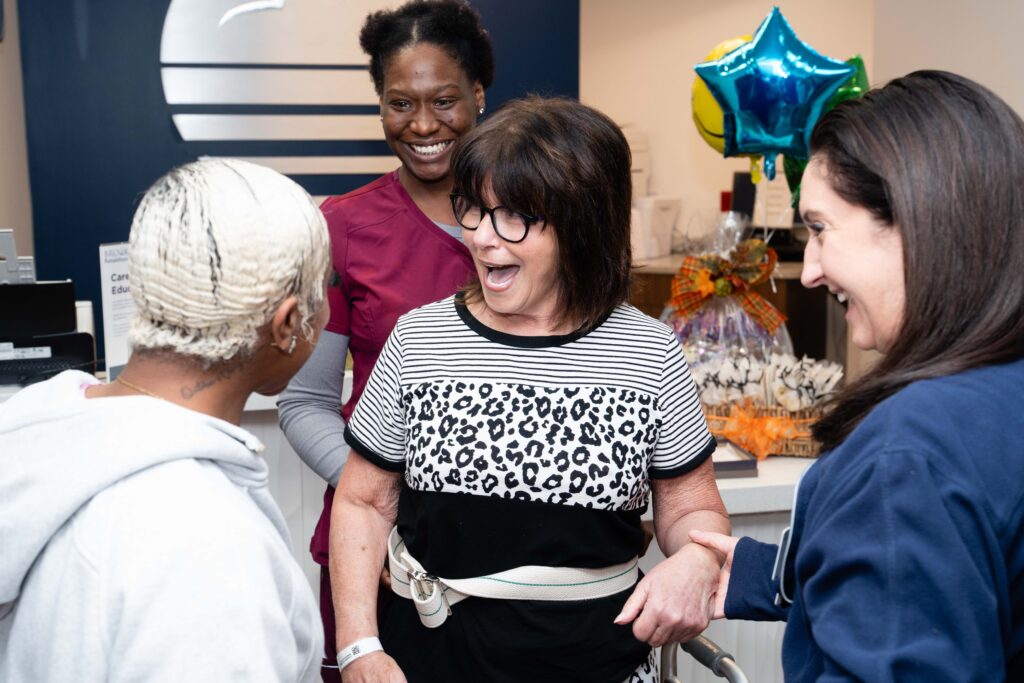 Patient talking to people and smiling