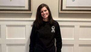 Ryan posing in front of two frames