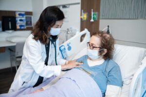 Dr. Lee listening to patient's heart