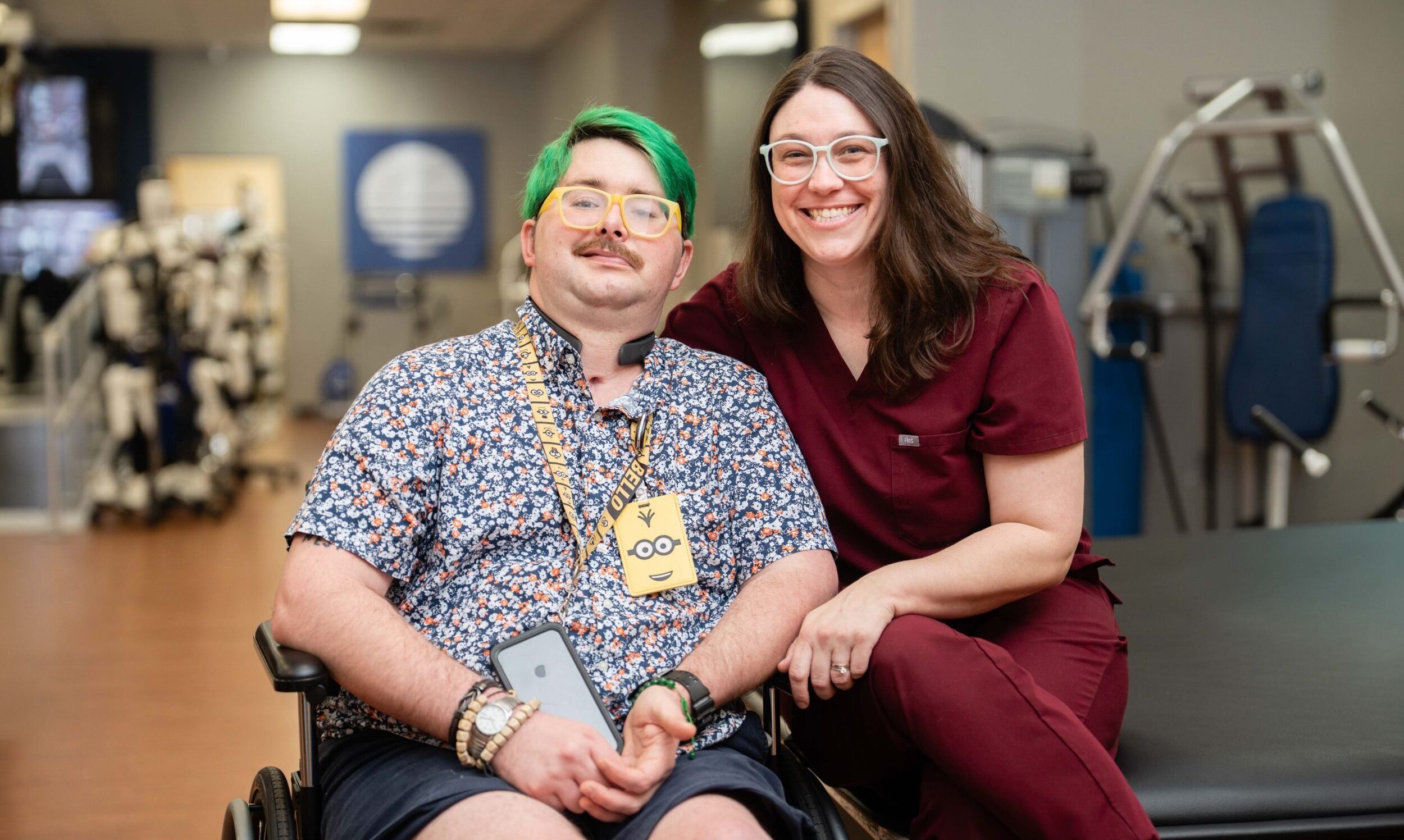 Patient in wheelchair sitting with Brooks therapist