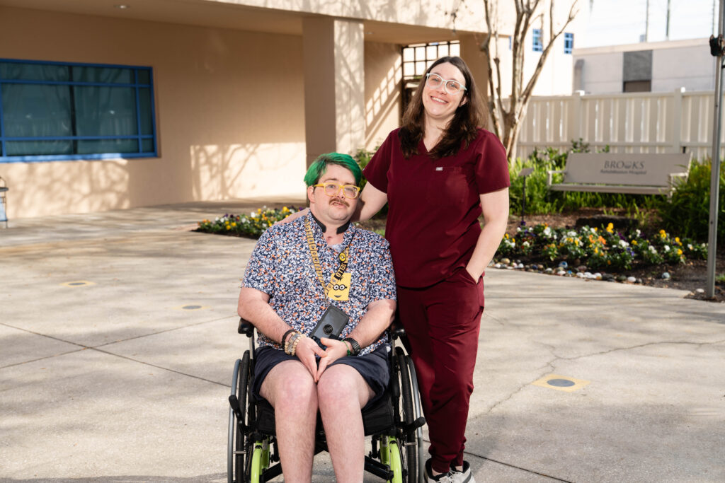 Nick and Kesley posing outside